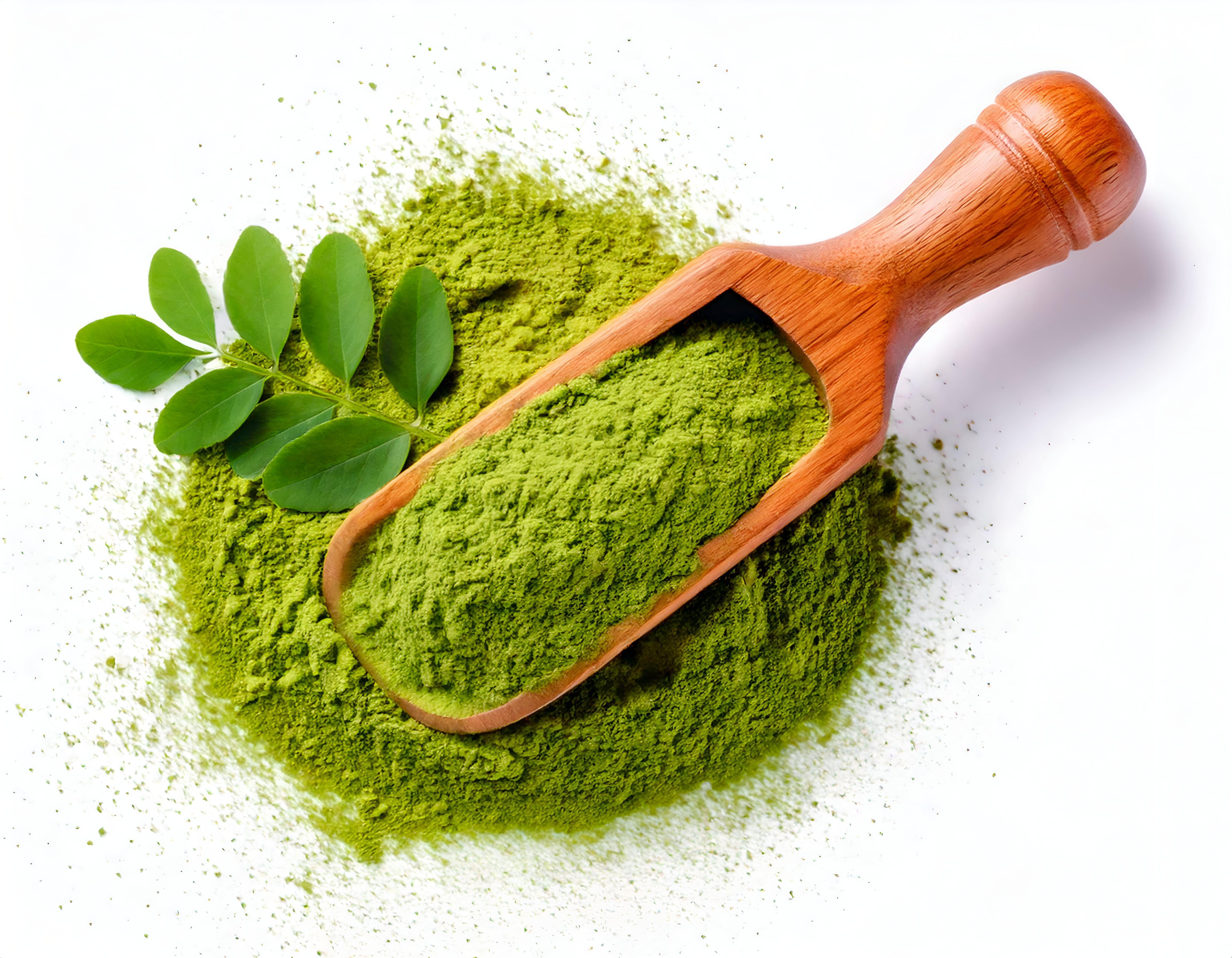 Top-view-of-moringa-powder-wooden-spoon-with-moringa-leaf-on-powder.
